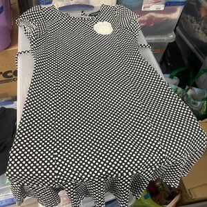 Girls polyester dress with Crocheted flower detail. Size M (7-8)